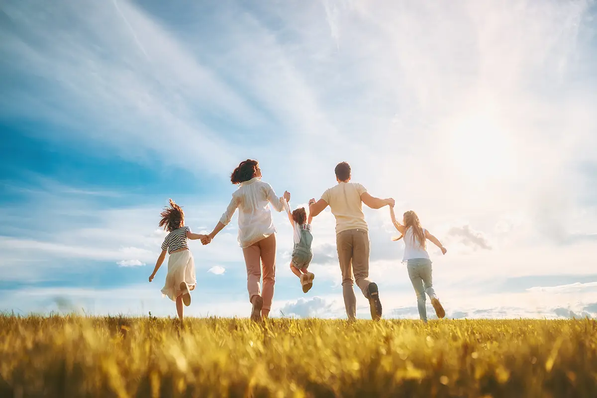 Happy family enjoying their reunification visa.
